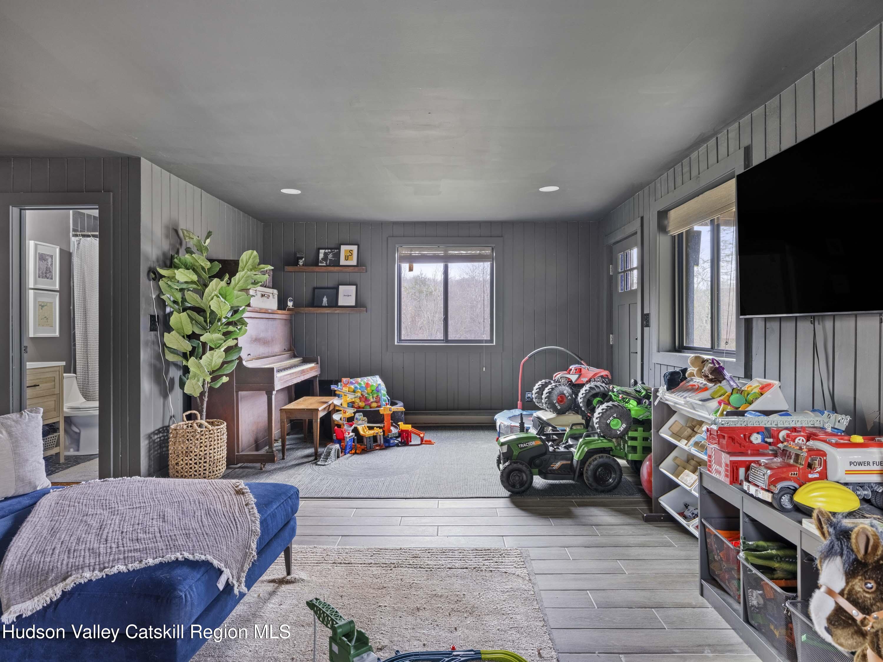 85 Bobillen Road Jewett, NY 12444 - Photo 19 of 59 a bedroom with furniture and a small space