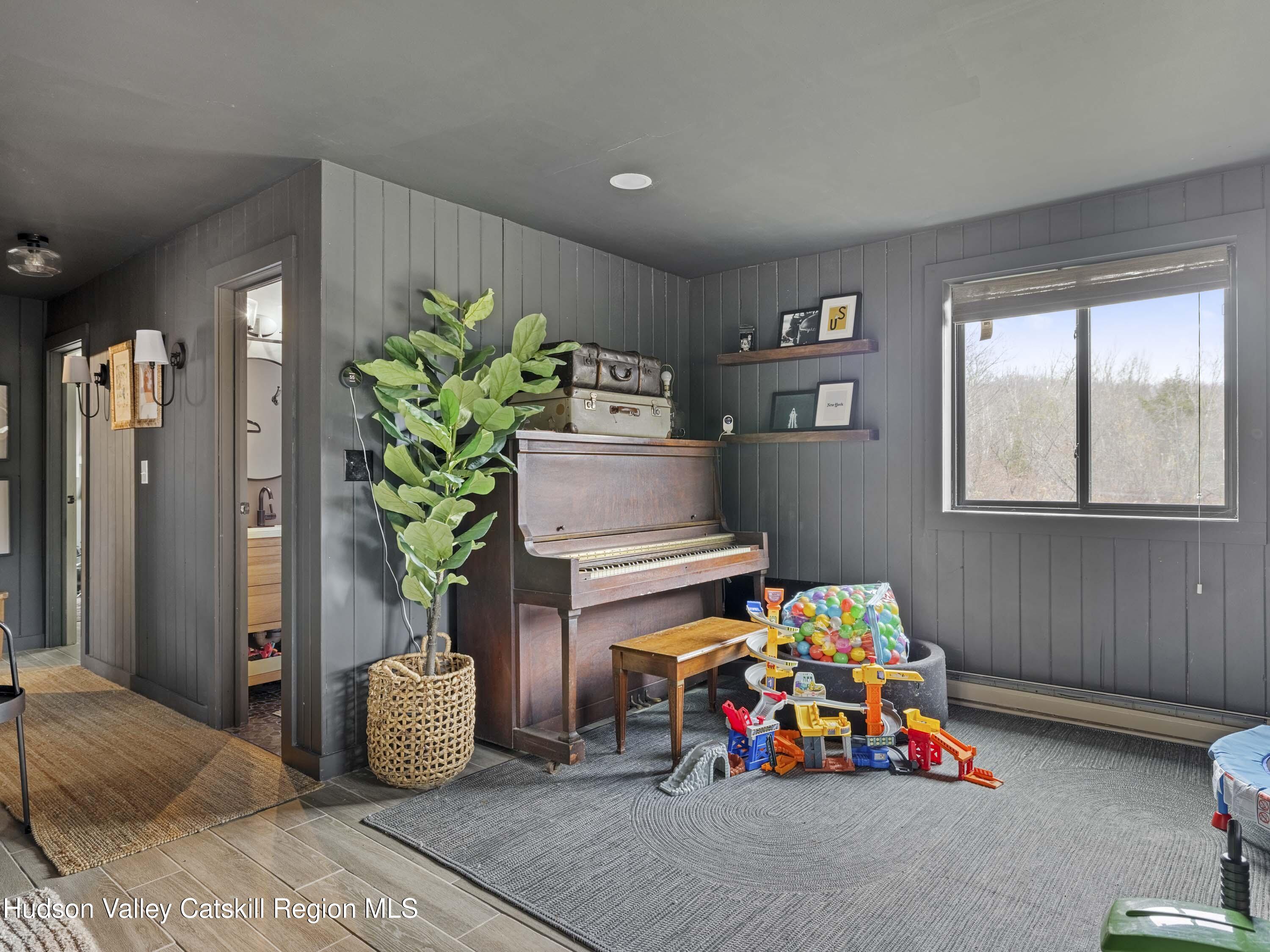 85 Bobillen Road Jewett, NY 12444 - Photo 21 of 59 a children room with toys and a potted plant