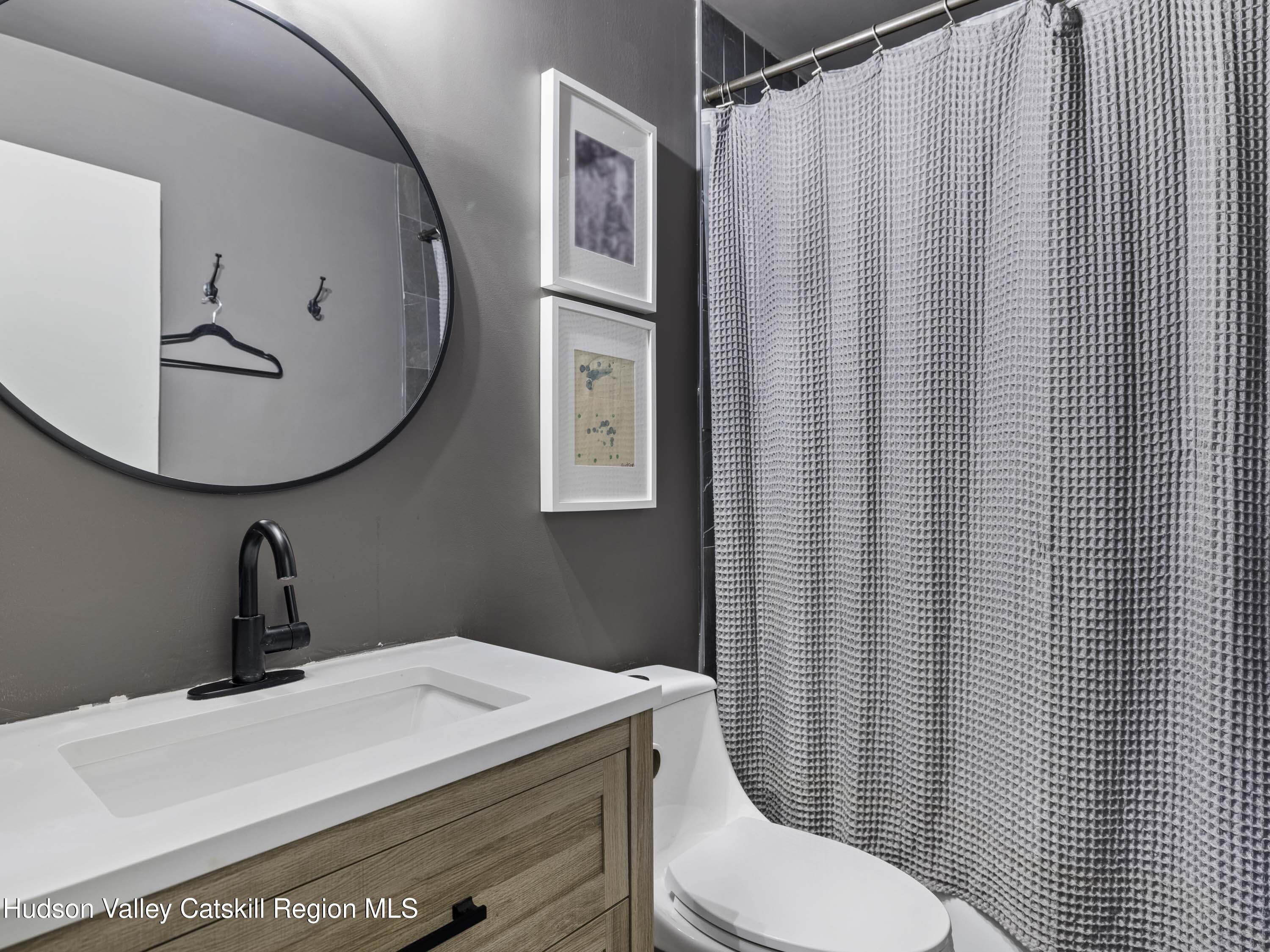 85 Bobillen Road Jewett, NY 12444 - Photo 22 of 59 a bathroom with a toilet and a mirror