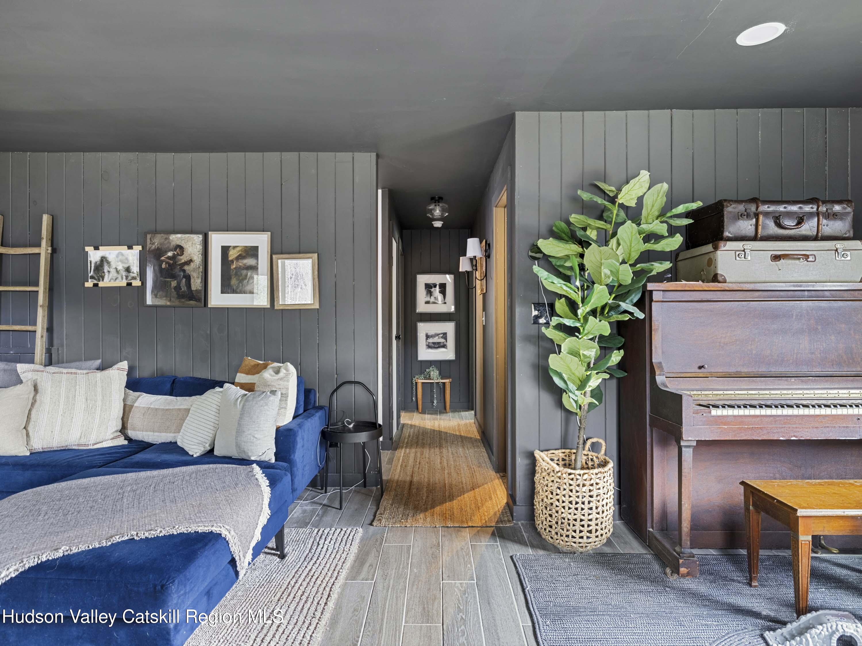 85 Bobillen Road Jewett, NY 12444 - Photo 23 of 59 a living room with furniture flowerpot and wooden floor
