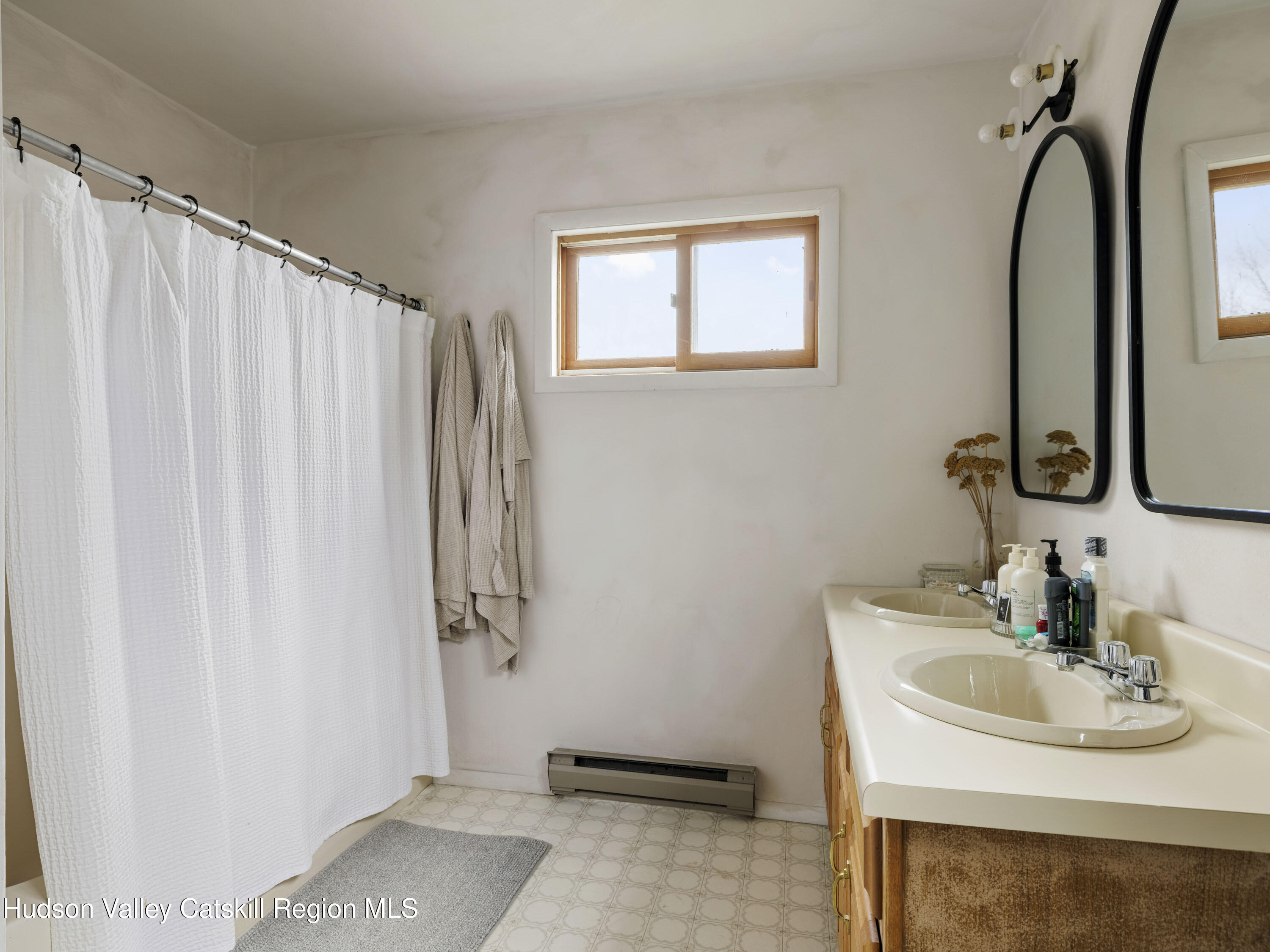 85 Bobillen Road Jewett, NY 12444 - Photo 45 of 59 a bathroom with a sink a mirror and a shower