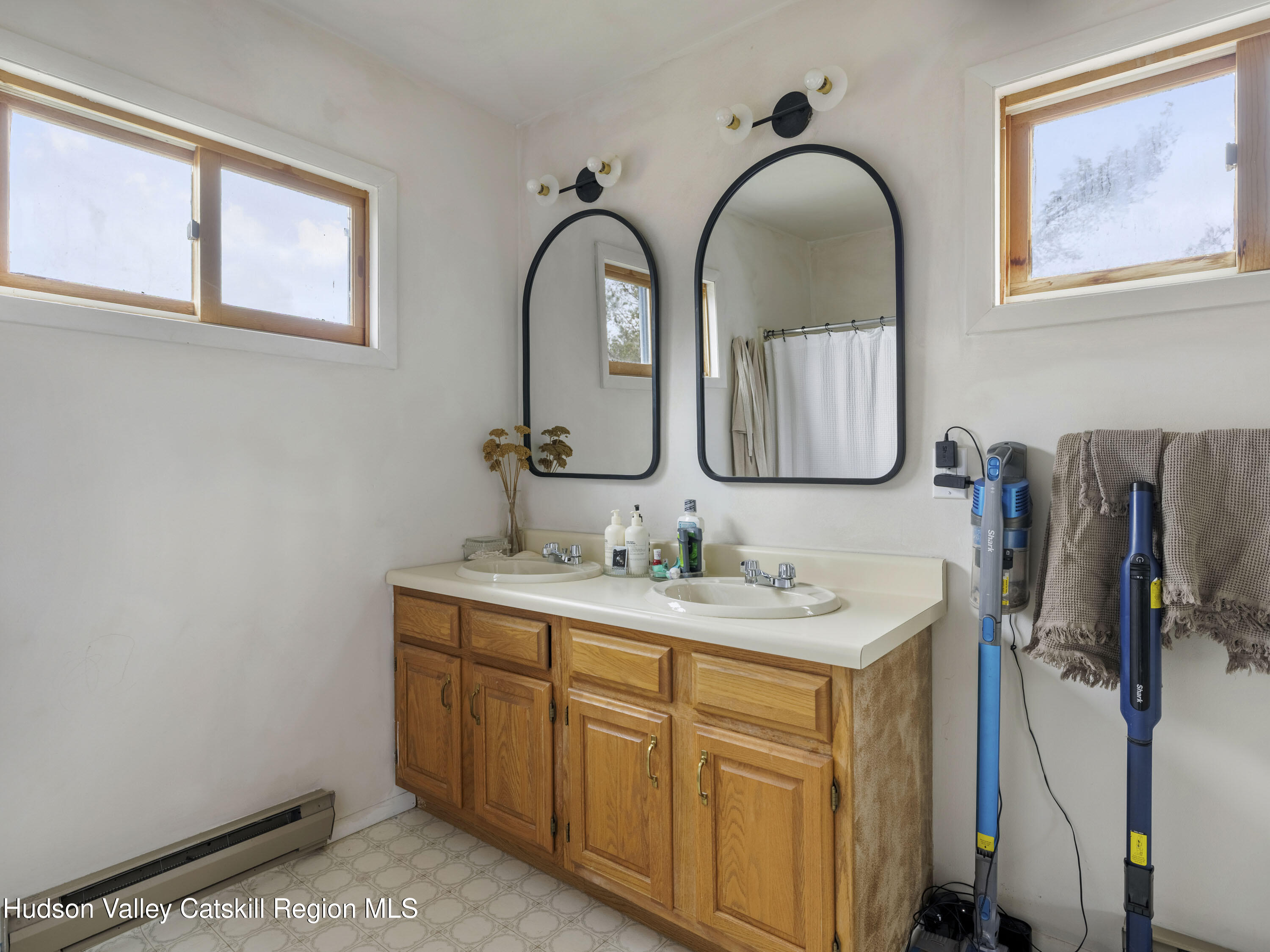 85 Bobillen Road Jewett, NY 12444 - Photo 46 of 59 a bathroom with a granite countertop sink a mirror and vanity