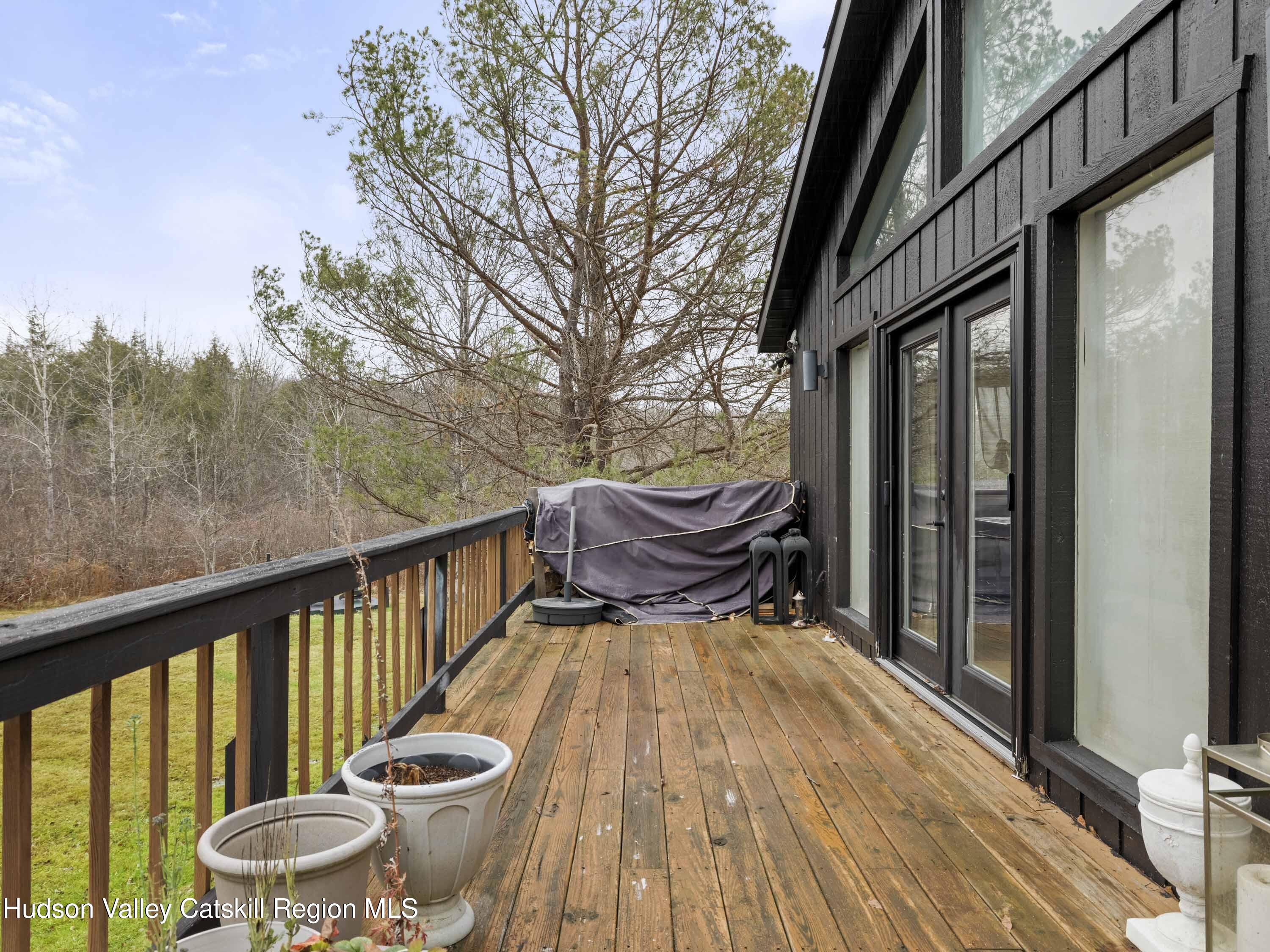 85 Bobillen Road Jewett, NY 12444 - Photo 47 of 59 a view of balcony with wooden floor and outdoor seating
