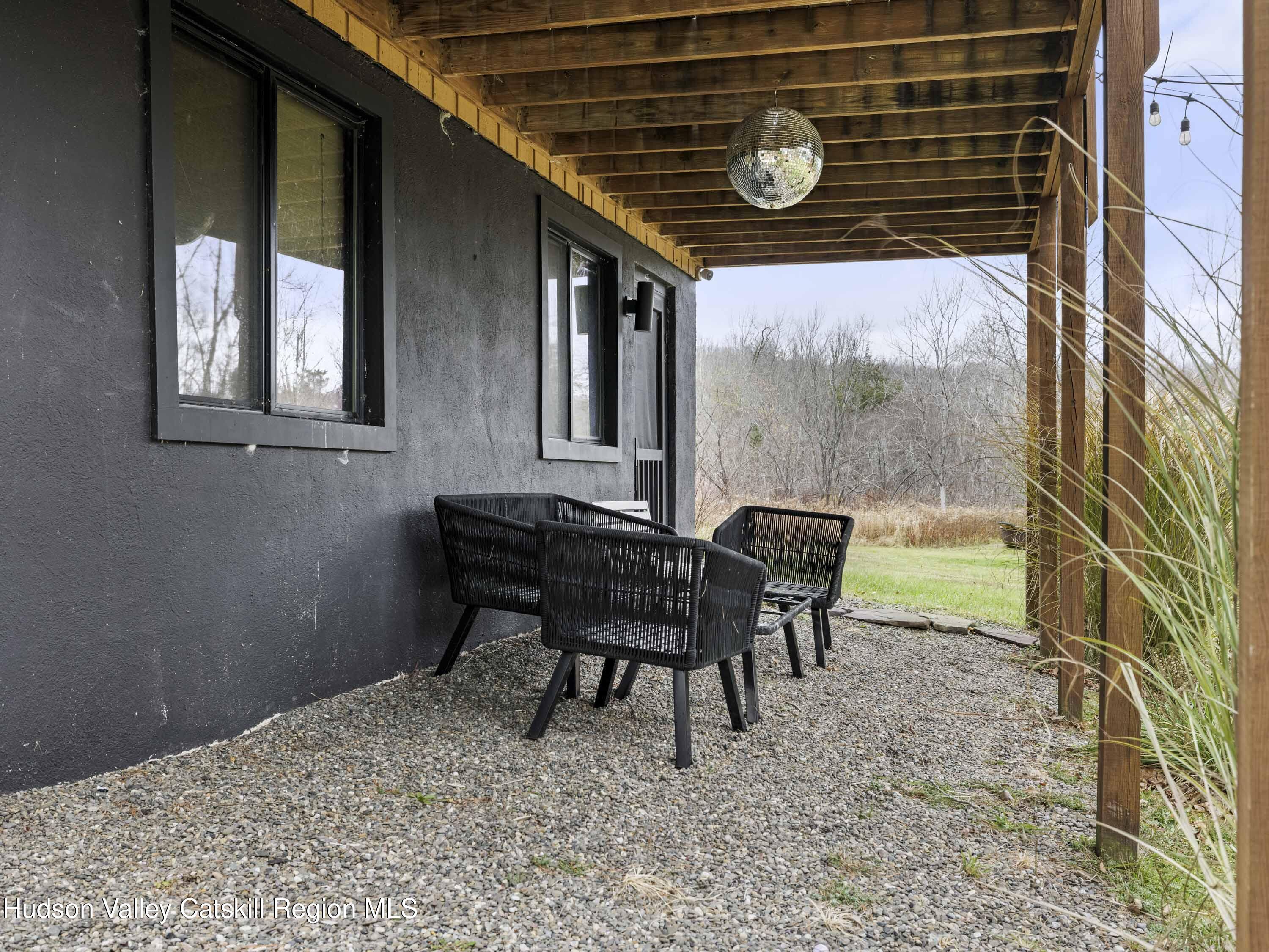 85 Bobillen Road Jewett, NY 12444 - Photo 55 of 59 a backyard of a house with table and chairs