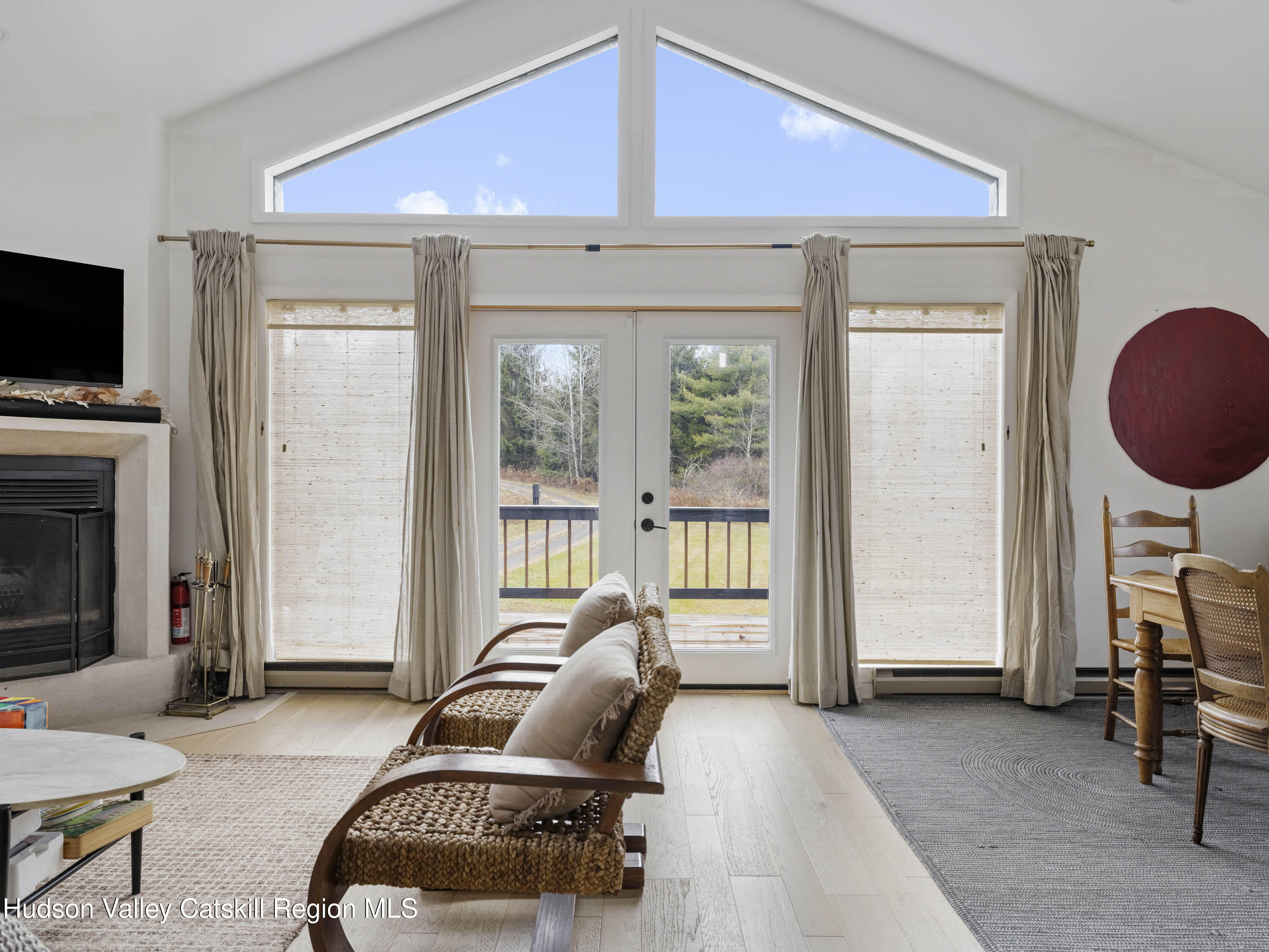 85 Bobillen Road Jewett, NY 12444 - Photo 8 of 59 a living room with furniture a flat screen tv and a large window