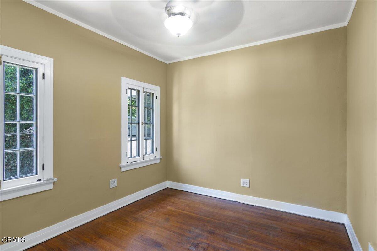 1136 East Rio Grande Street Pasadena, CA 91104 - Photo 16 of 30 an empty room with wooden floor and windows