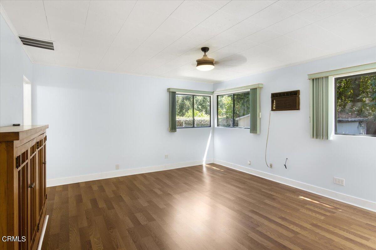 1136 East Rio Grande Street Pasadena, CA 91104 - Photo 17 of 30 a view of an empty room with wooden floor and a window