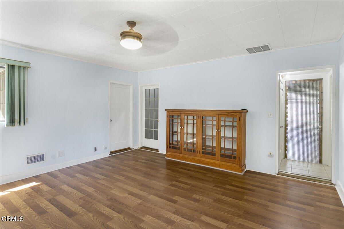 1136 East Rio Grande Street Pasadena, CA 91104 - Photo 18 of 30 a view of an empty room with wooden floor and a window