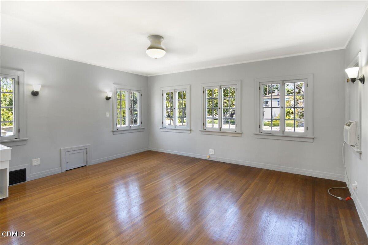 1136 East Rio Grande Street Pasadena, CA 91104 - Photo 23 of 30 a view of an empty room with window and wooden floor