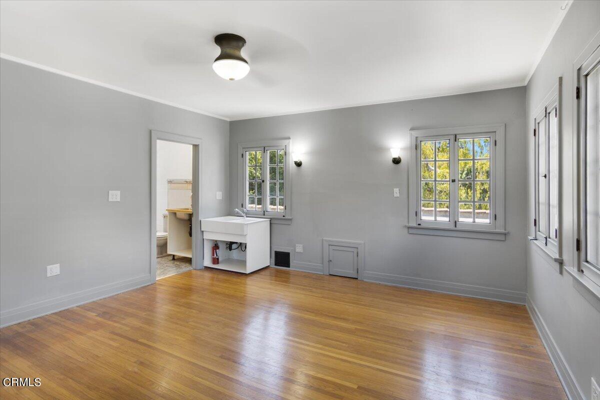 1136 East Rio Grande Street Pasadena, CA 91104 - Photo 24 of 30 a view of empty room with wooden floor and fan
