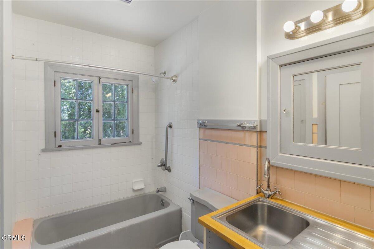 1136 East Rio Grande Street Pasadena, CA 91104 - Photo 25 of 30 a bathroom with a sink a bathtub and window