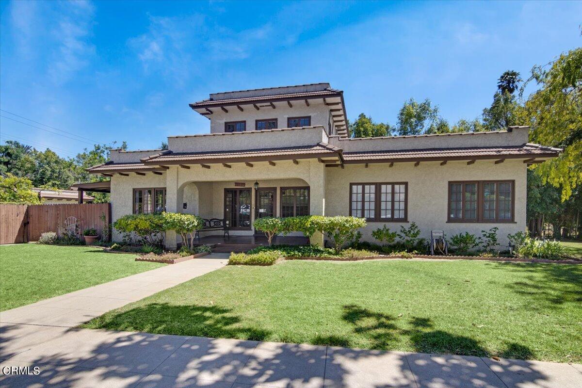 1136 East Rio Grande Street Pasadena, CA 91104 - Photo 4 of 30 a front view of a house with a yard