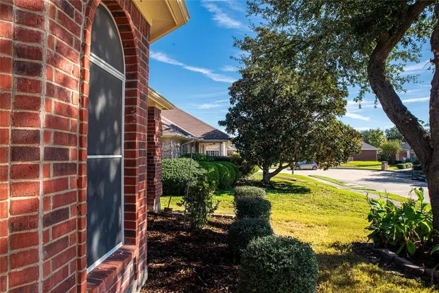 a view of swimming pool with outdoor seating and plants