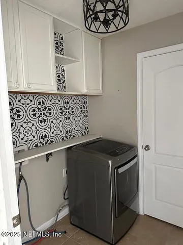 a utility room with cabinets