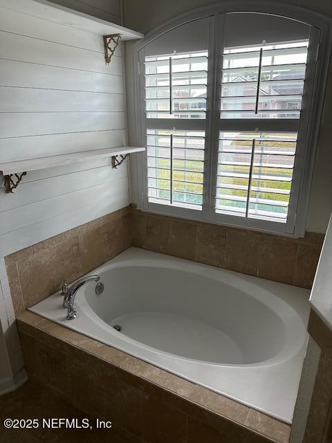 3022 Plantation Ridge Drive Green Cove Springs, FL 32043 - Photo 7 of 15 a bath tub sitting in a bathroom next to a window