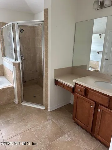 a bathroom with a shower and a sink