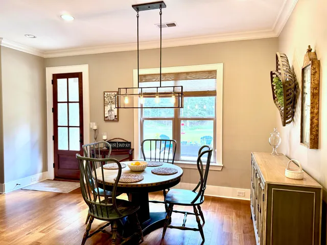 a view of a dining room with furniture and window