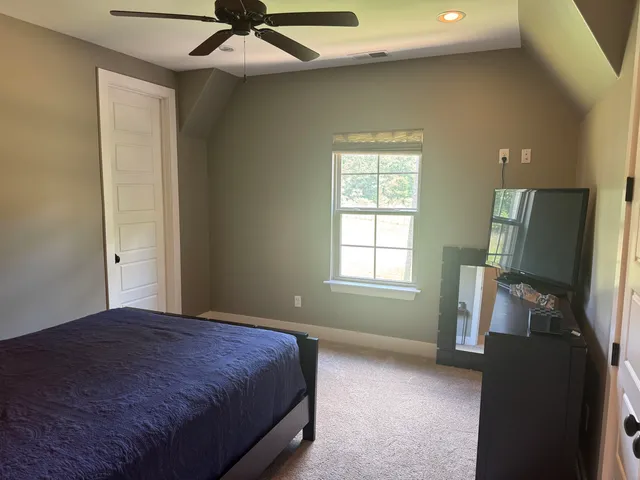 a bathroom with a glass shower door