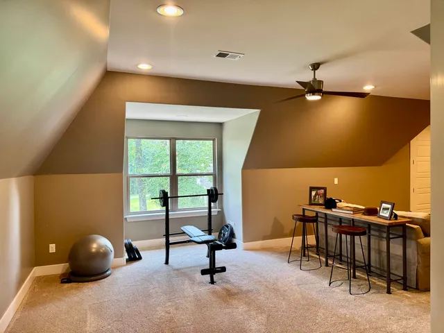 a bedroom with a stove and a cabinet