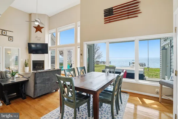 a dining room with furniture a chandelier and a rug