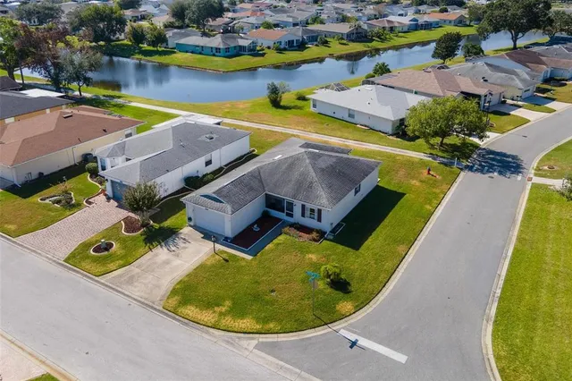 an aerial view of a house with a swimming pool