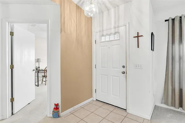 a view of walk in closet with white walls