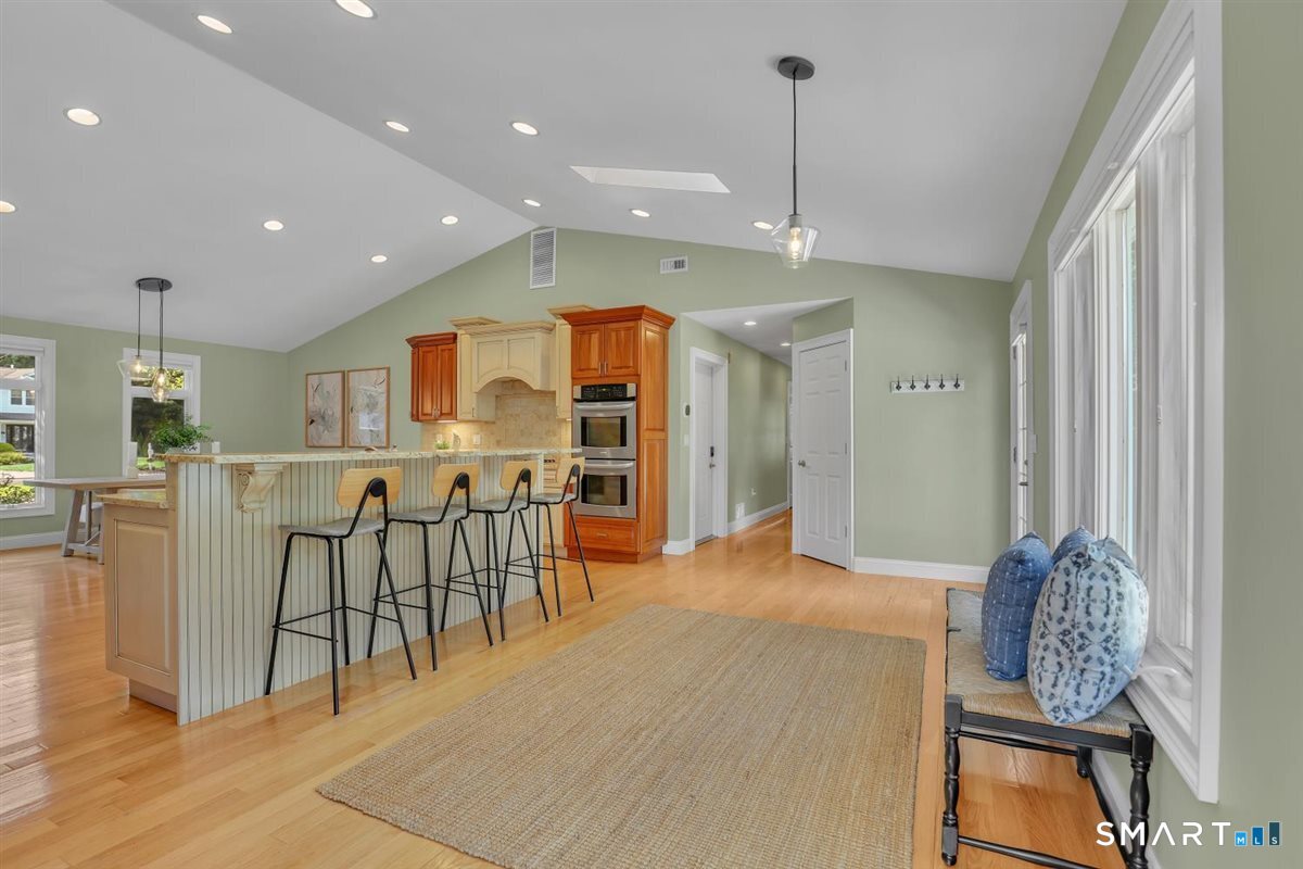 361 Miles Road Orange, CT 06477 - Photo 9 of 40 Light-filled kitchen with a versatile breakfast nook/dining area that can also serve as a comfortable sitting or gathering space.
