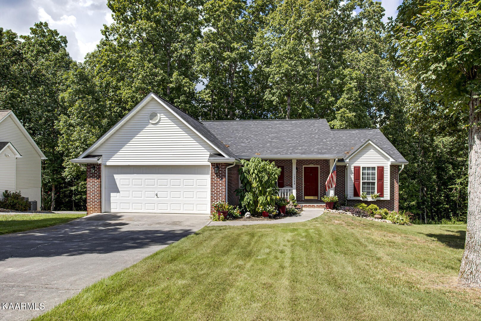 314 Ottawa Circle Loudon, TN 37774 - Photo 1 of 3 a front view of a house with a yard and garage