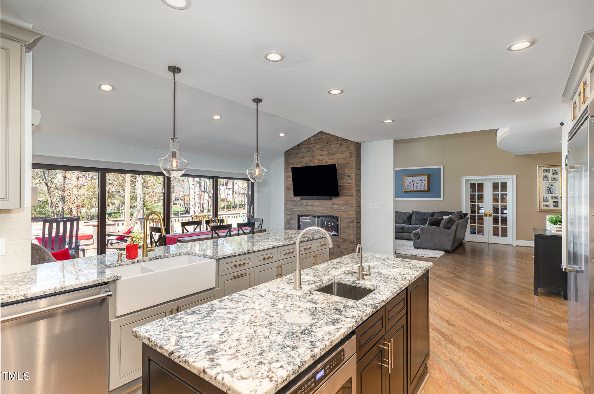 10841 Round Brook Circle Raleigh, NC 27617 - Photo 16 of 44 a kitchen with counter top space and living room view