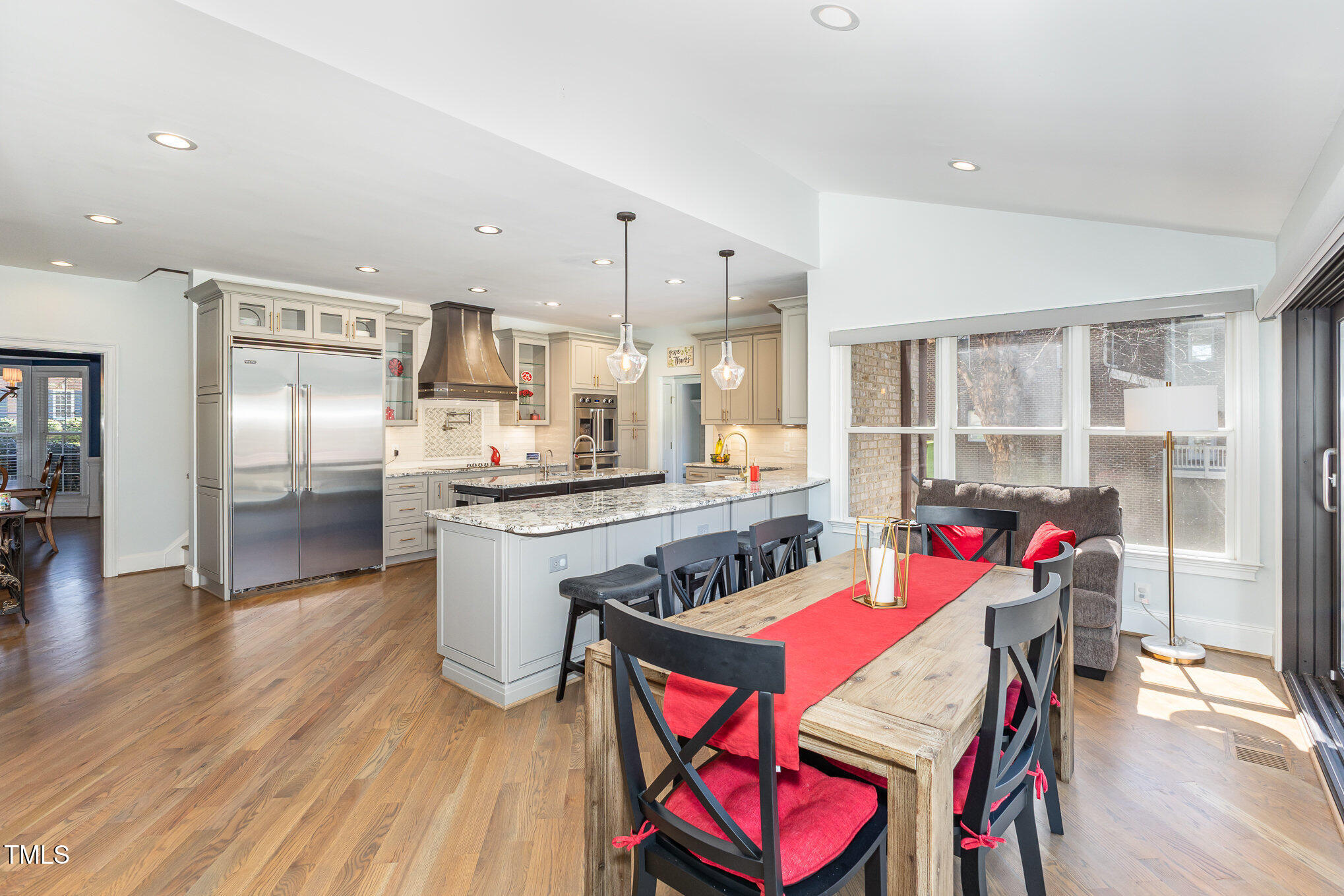 10841 Round Brook Circle Raleigh, NC 27617 - Photo 18 of 44 a kitchen with stainless steel appliances granite countertop a kitchen island hardwood floor and a sink