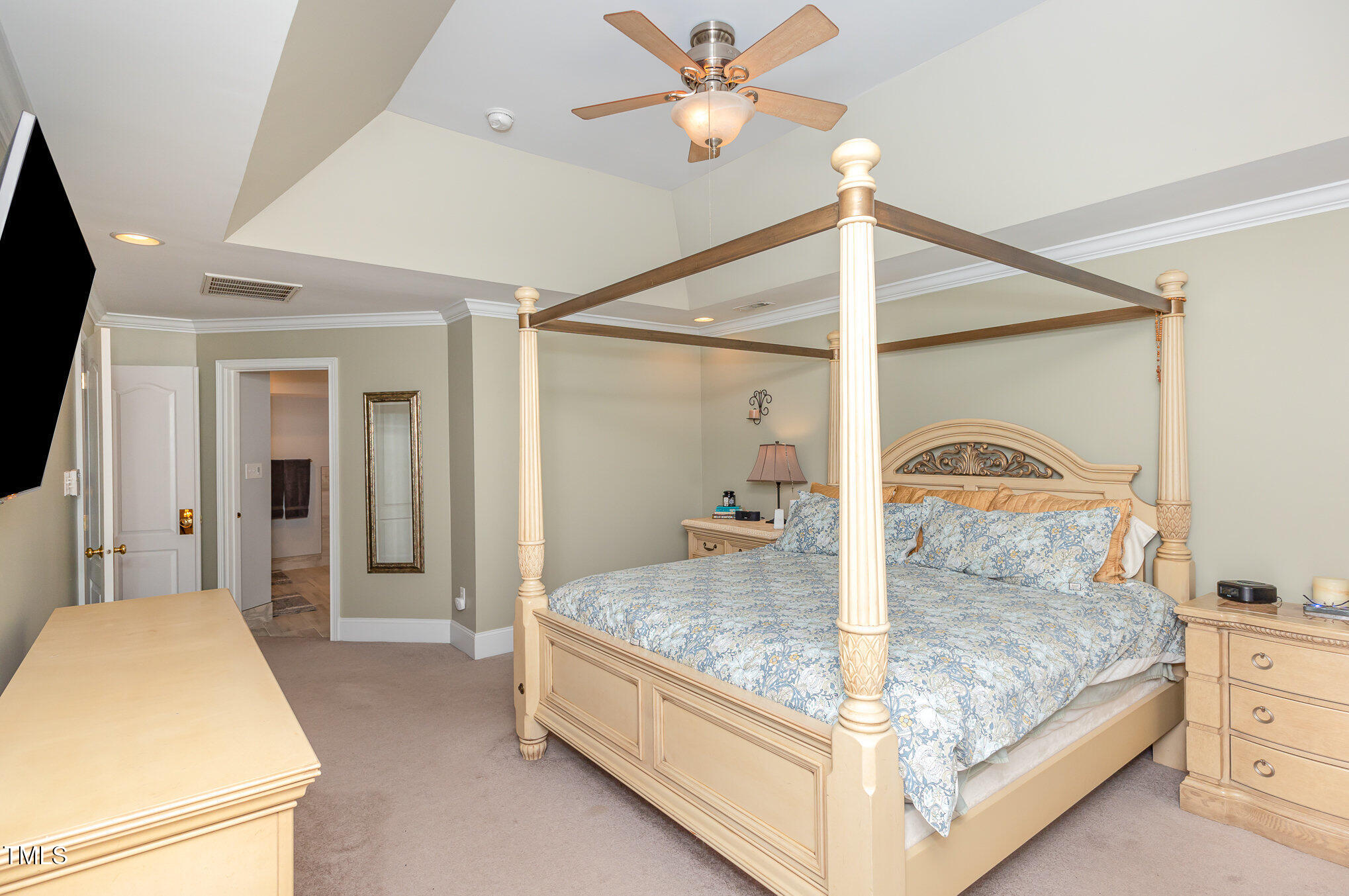 10841 Round Brook Circle Raleigh, NC 27617 - Photo 21 of 44 a bedroom with a bed and a mirror