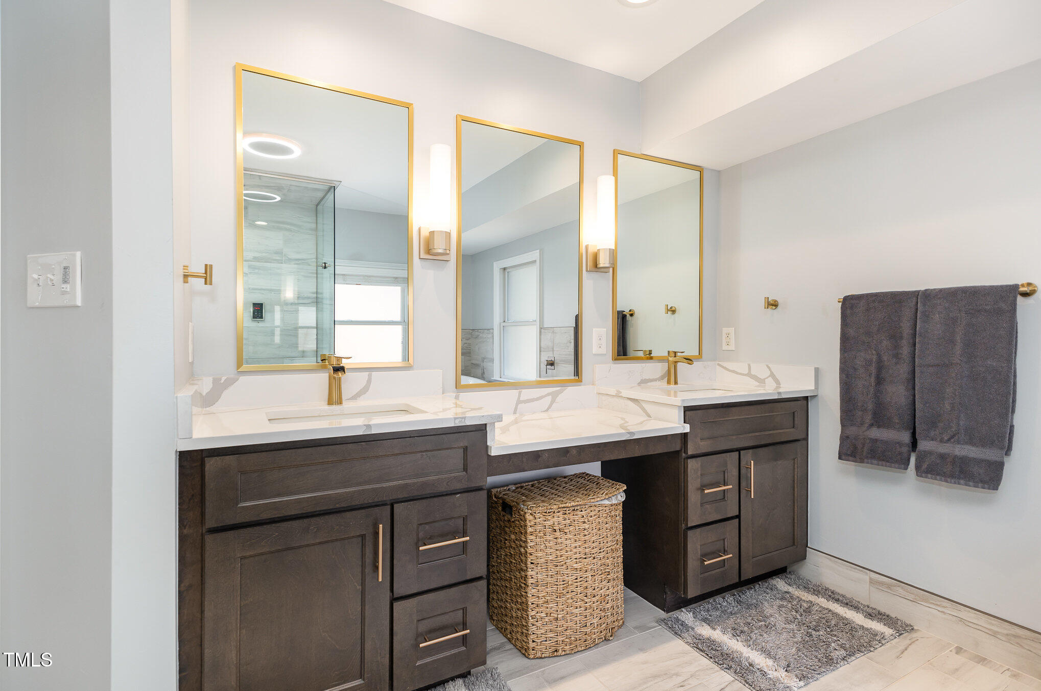 10841 Round Brook Circle Raleigh, NC 27617 - Photo 22 of 44 a bathroom with a granite countertop sink and a mirror