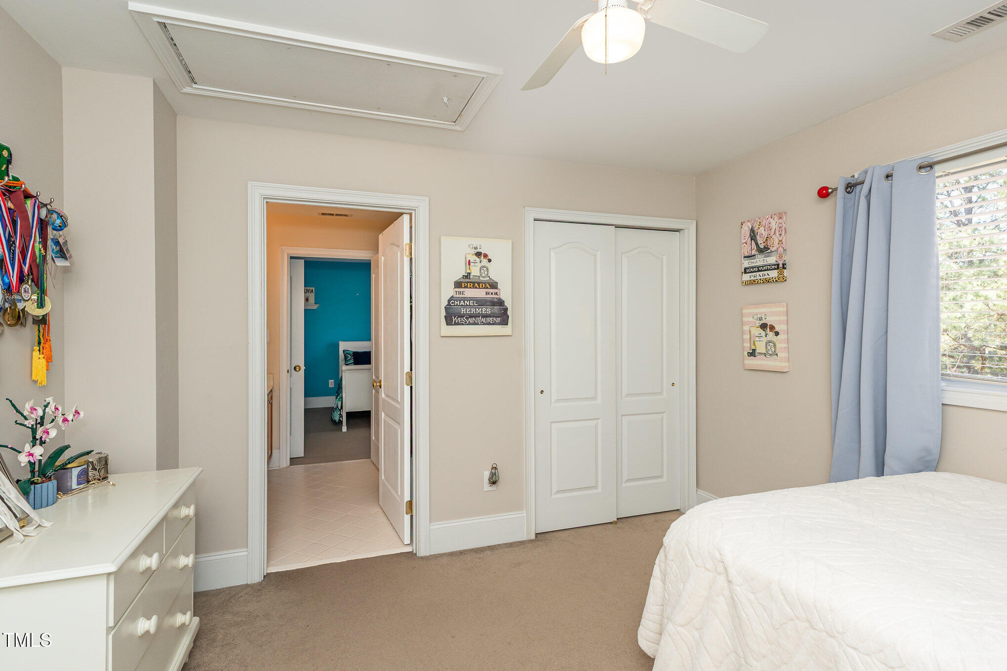 10841 Round Brook Circle Raleigh, NC 27617 - Photo 24 of 44 a spacious bedroom with a bed and a potted plant