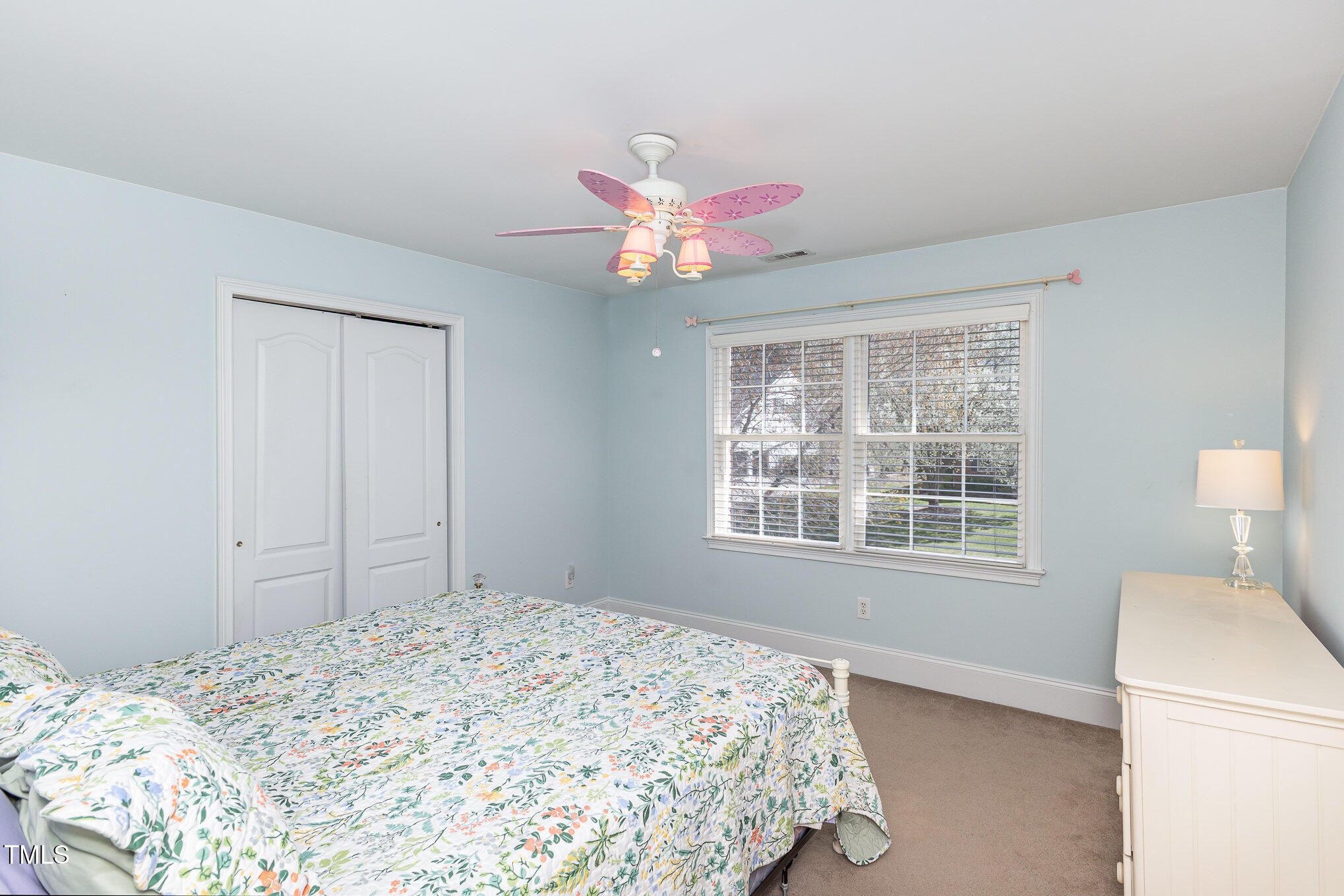 10841 Round Brook Circle Raleigh, NC 27617 - Photo 26 of 44 a bedroom with a bed and a chandelier
