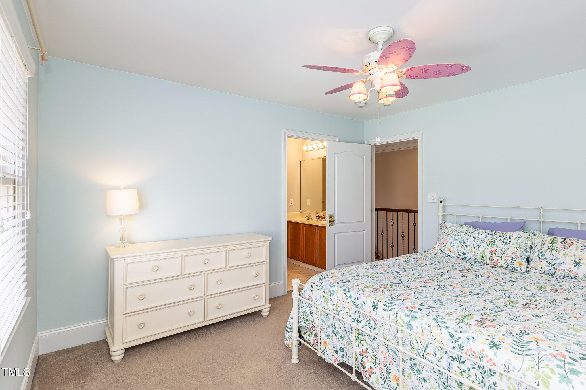 10841 Round Brook Circle Raleigh, NC 27617 - Photo 27 of 44 a bedroom with a bed and a chandelier