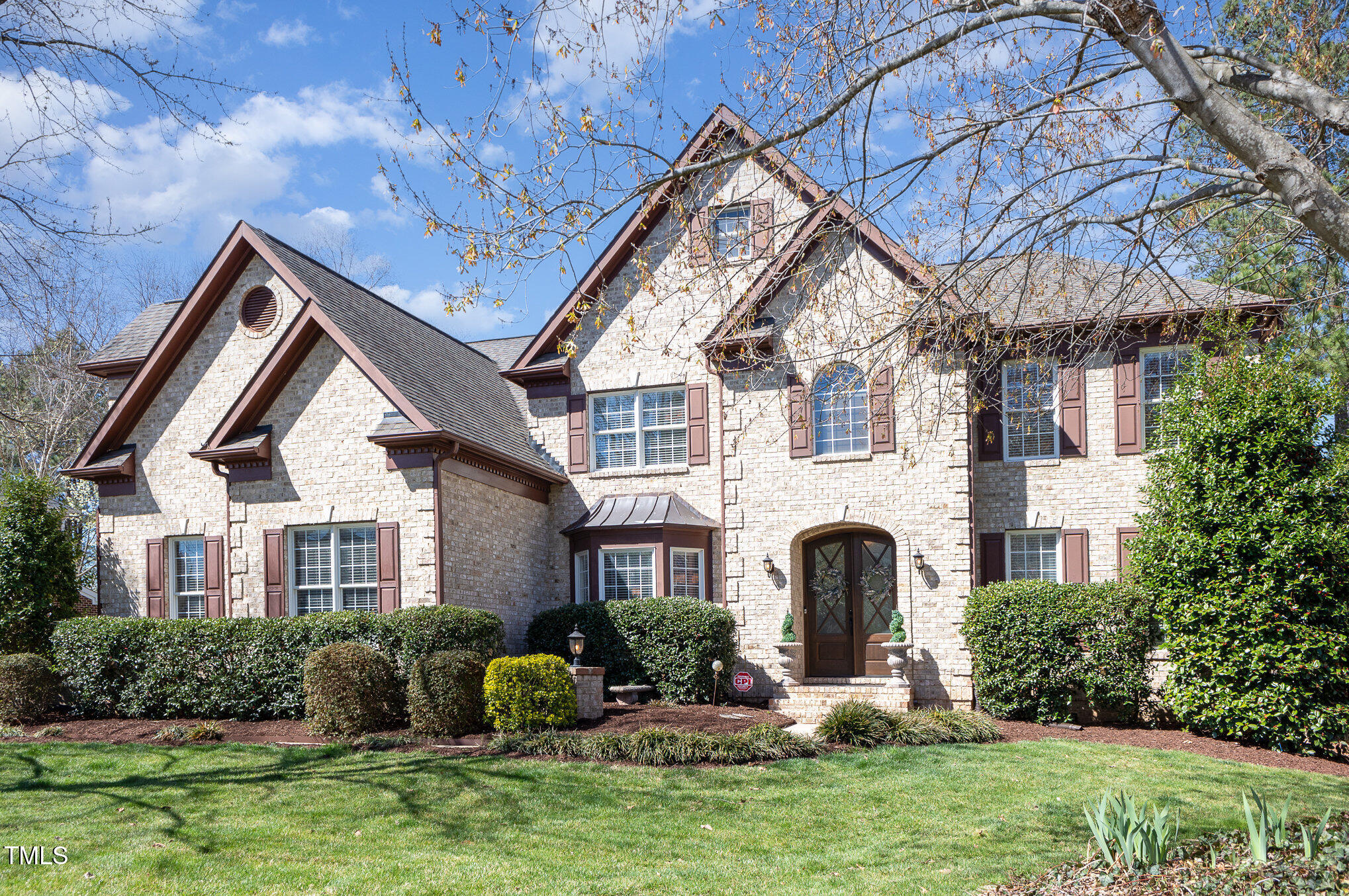 10841 Round Brook Circle Raleigh, NC 27617 - Photo 3 of 44 a front view of a house with yard and porch