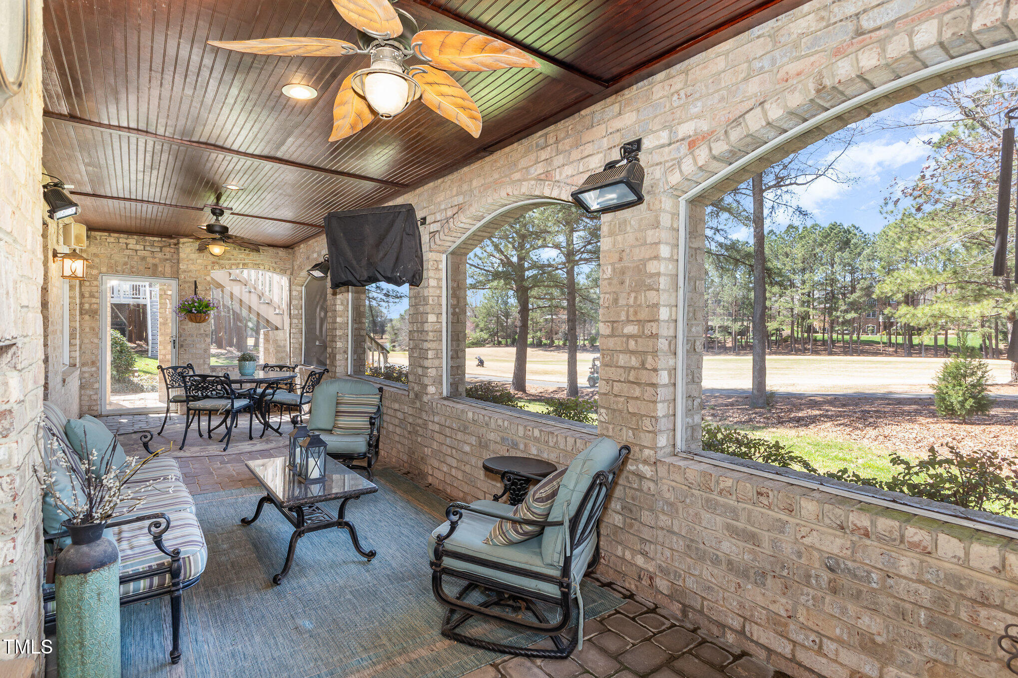 10841 Round Brook Circle Raleigh, NC 27617 - Photo 38 of 44 a living room with furniture and a floor to ceiling window