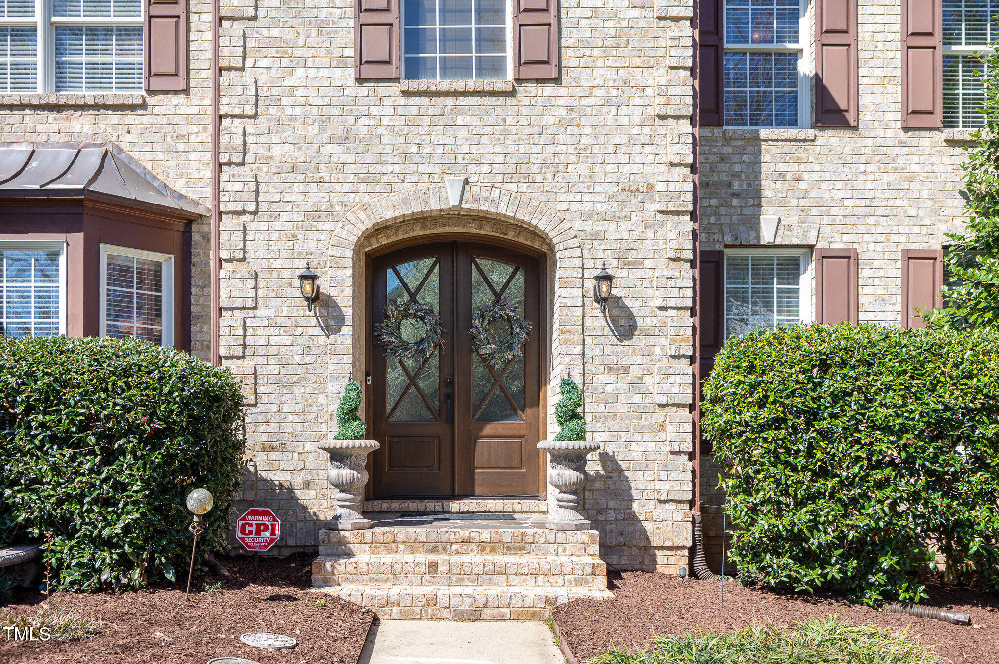 10841 Round Brook Circle Raleigh, NC 27617 - Photo 4 of 44 a front view of a house with a garden
