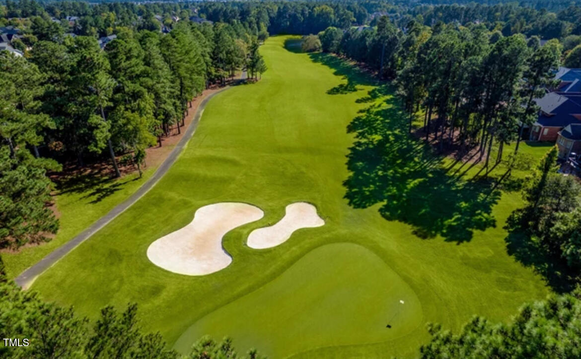 10841 Round Brook Circle Raleigh, NC 27617 - Photo 44 of 44 a view of a table and chairs in the backyard