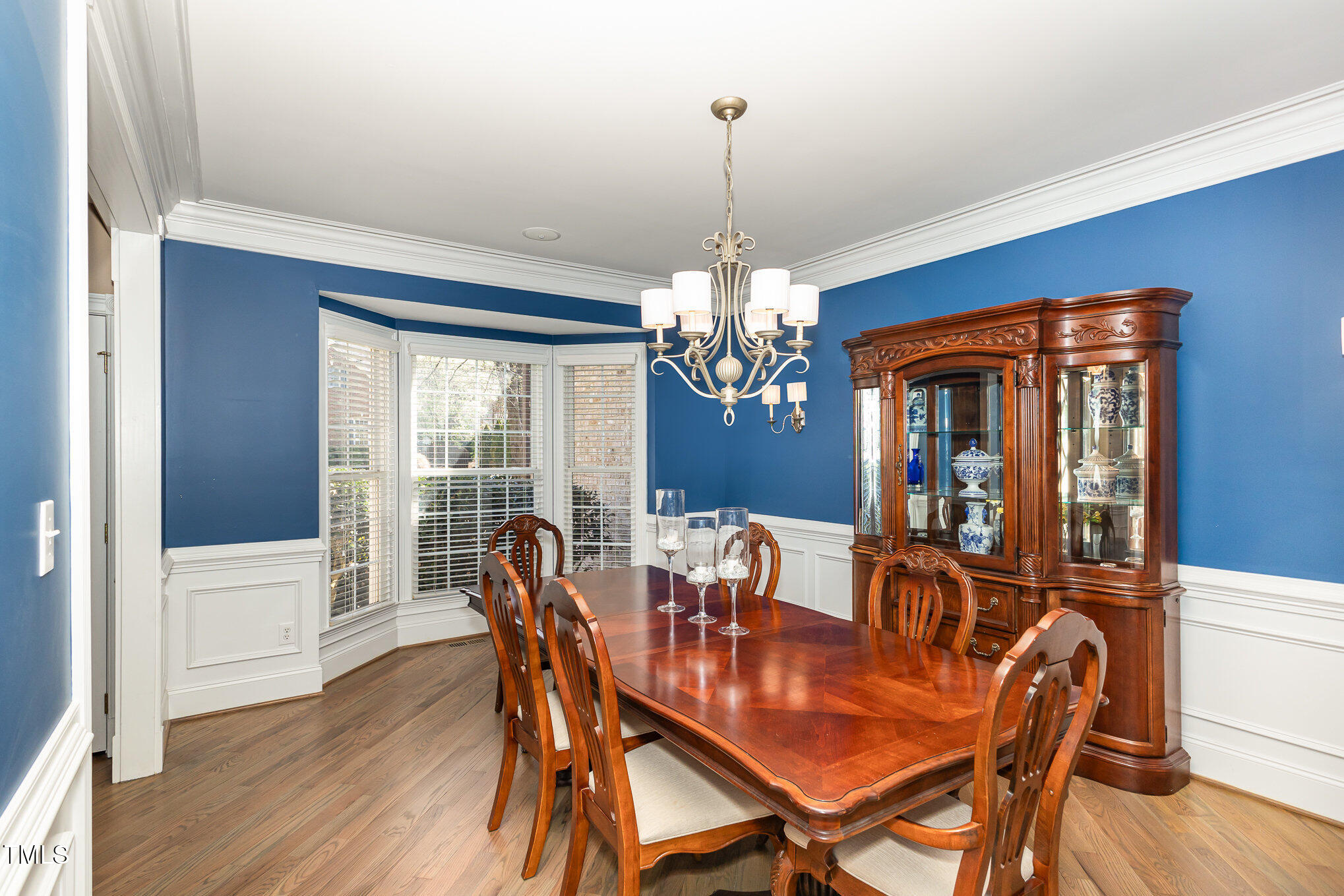 10841 Round Brook Circle Raleigh, NC 27617 - Photo 7 of 44 a view of a dining room with furniture window and wooden floor