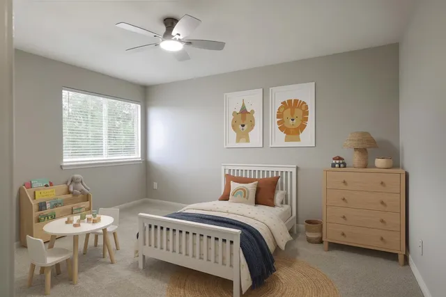 a bedroom with a bed and a window