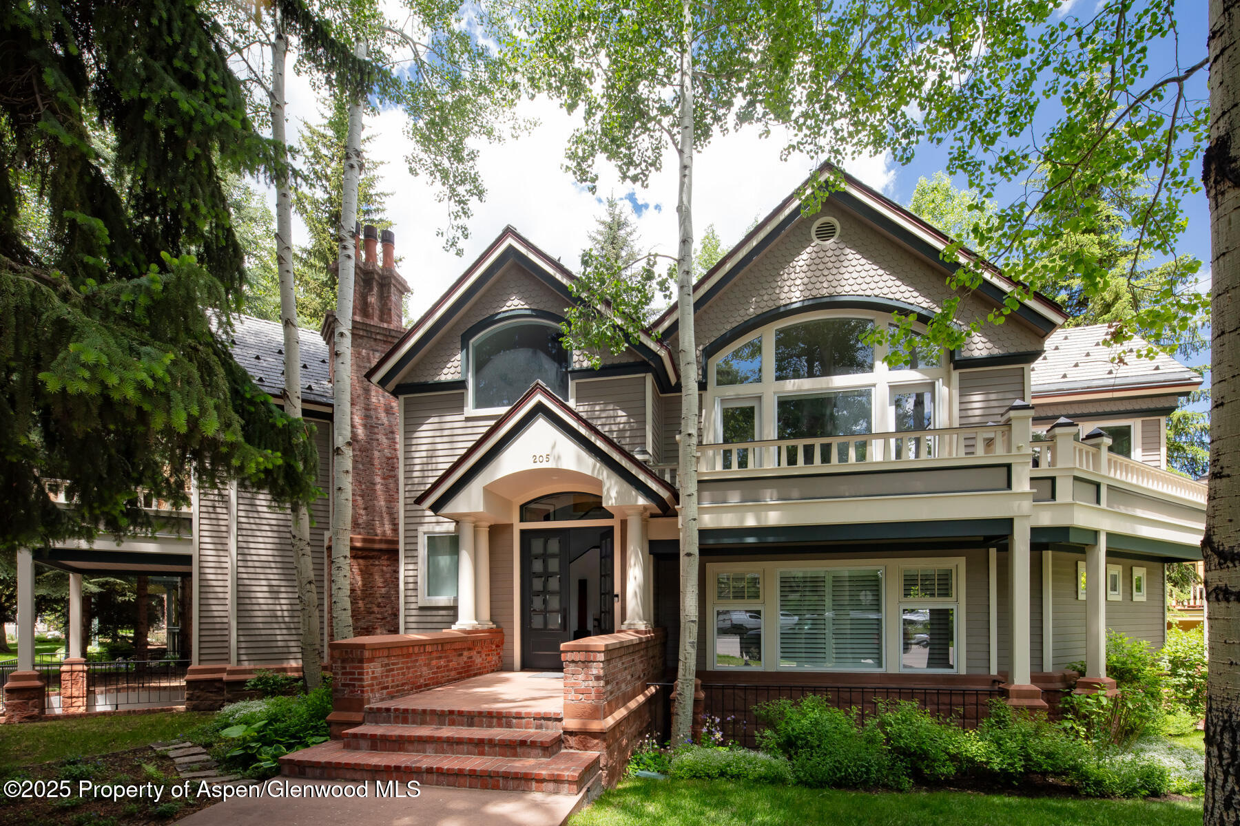 205 North 6th Street Aspen, CO 81611 - Photo 1 of 29 a front view of a house with garden
