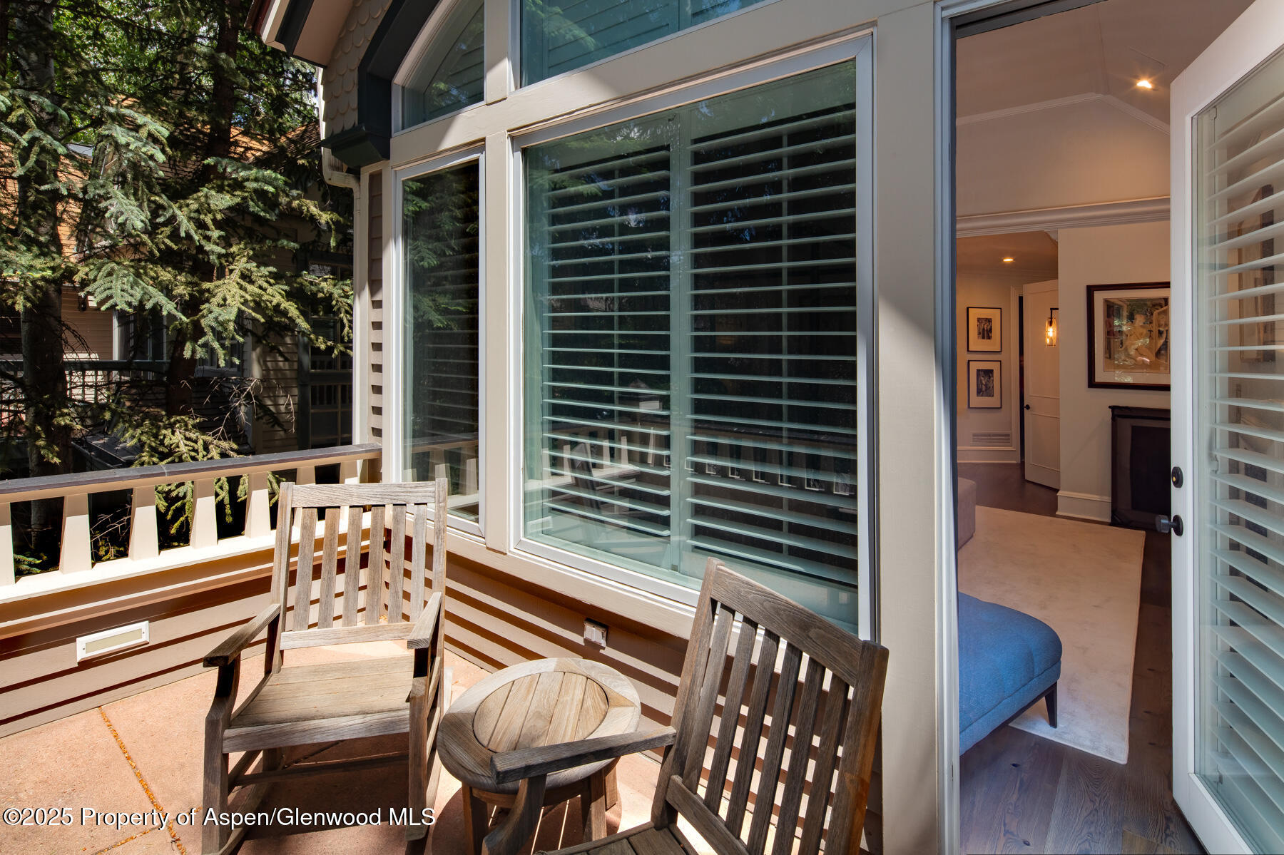 205 North 6th Street Aspen, CO 81611 - Photo 12 of 29 a view of a patio with table and chairs with wooden floor and fence