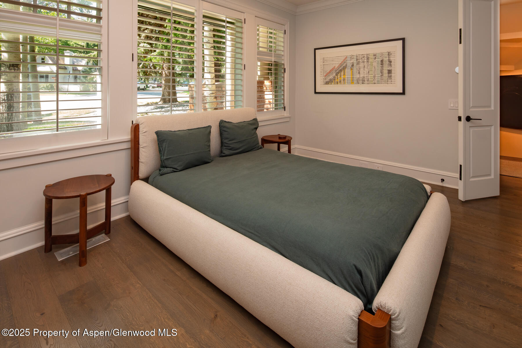 205 North 6th Street Aspen, CO 81611 - Photo 17 of 29 a bed sitting in a bedroom next to a window