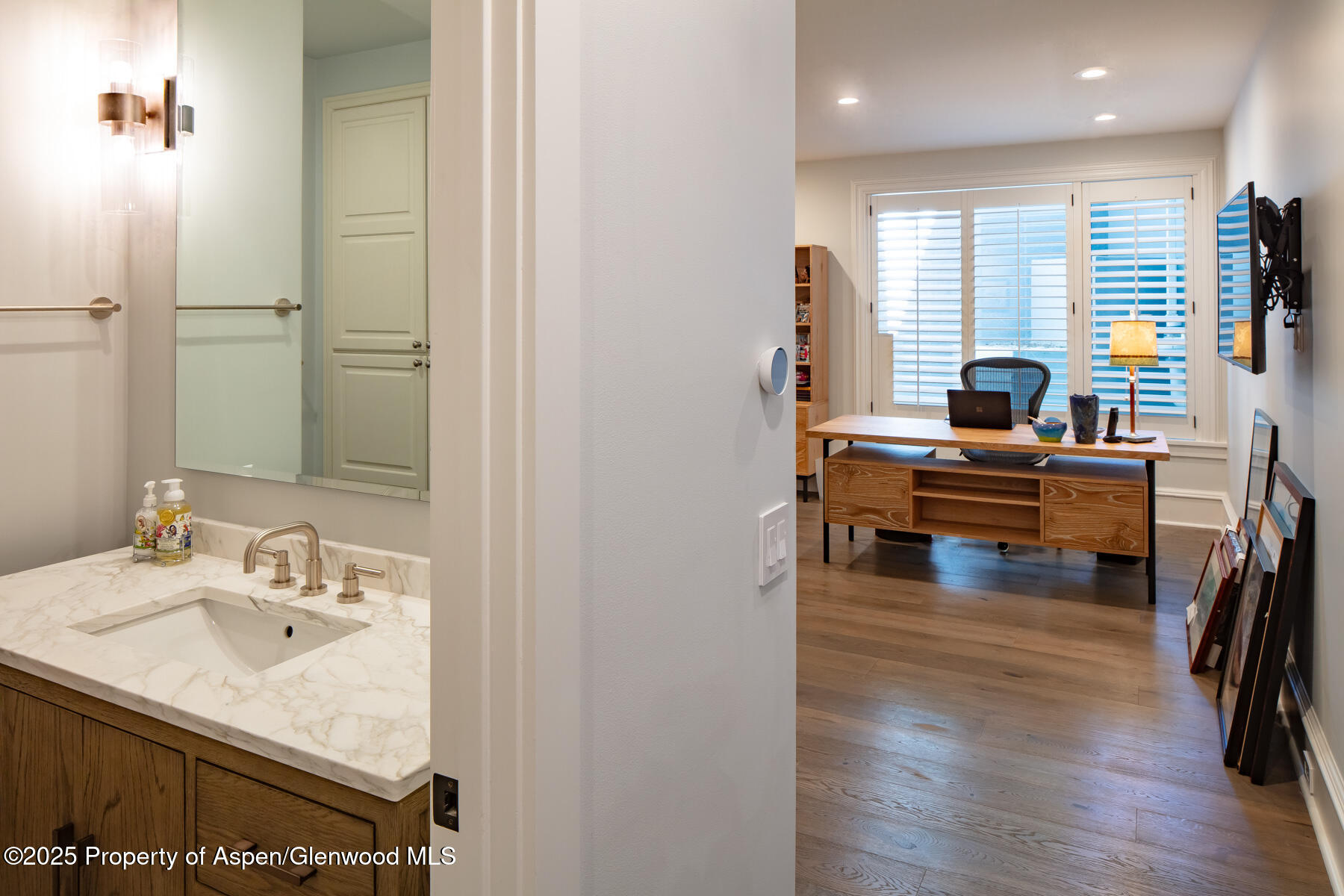 205 North 6th Street Aspen, CO 81611 - Photo 23 of 29 a living room with furniture and a large window