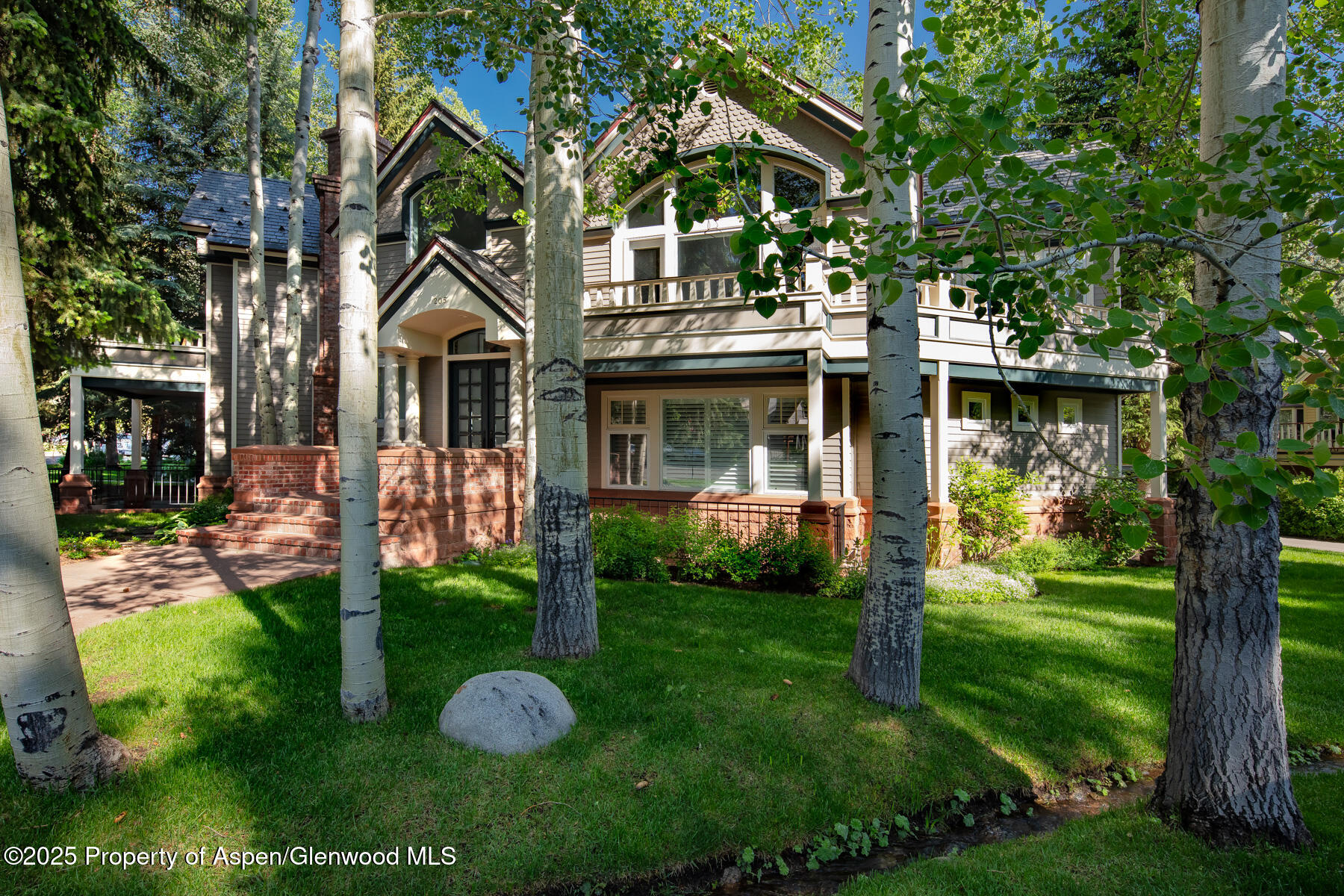 205 North 6th Street Aspen, CO 81611 - Photo 29 of 29 a front view of a house with garden