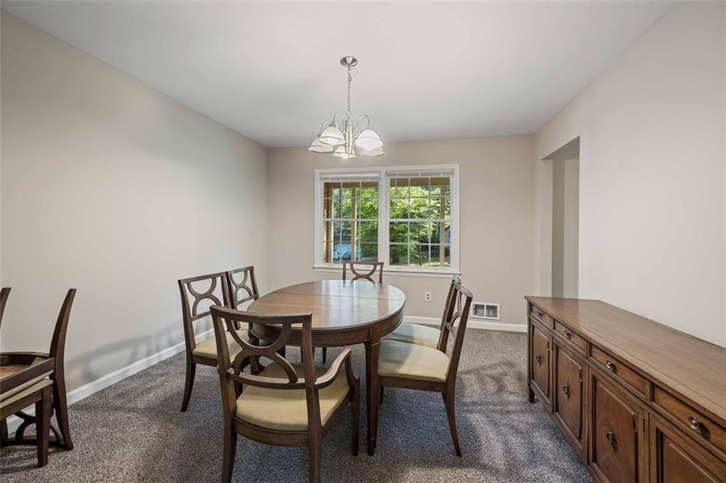4166 Rue St Michel Stone Mountain, GA 30083 - Photo 11 of 31 a view of a dining room with furniture window and outside view