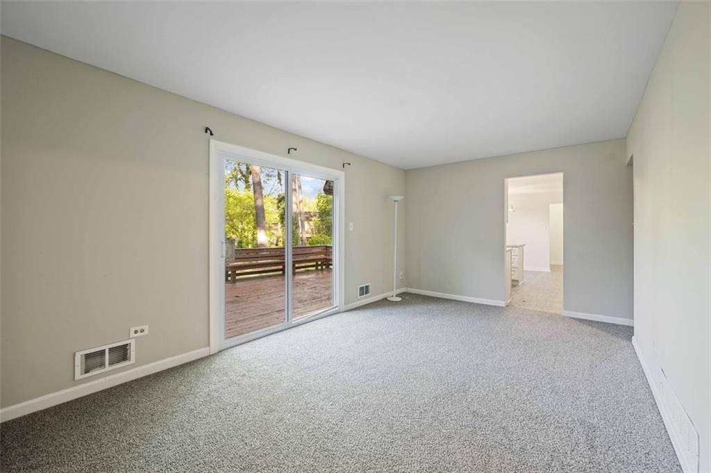 4166 Rue St Michel Stone Mountain, GA 30083 - Photo 12 of 31 an empty room with windows