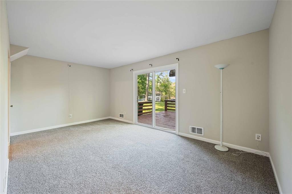 4166 Rue St Michel Stone Mountain, GA 30083 - Photo 13 of 31 a view of an empty room with a window