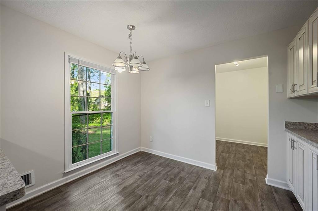 4166 Rue St Michel Stone Mountain, GA 30083 - Photo 18 of 31 a view of livingroom with hardwood floor and window